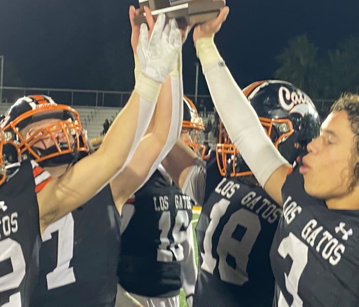 Jaylen Thomas (3), Spencer Burg (18), AJ Minyard (16) and Scott Garwood (7) among those holding up the CCS championship trophy.